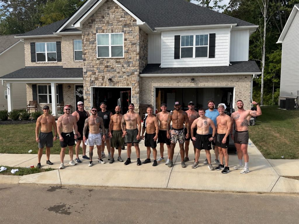 The group in front of the house after a Saturday session